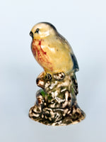 Small Ceramic Birds on Stump